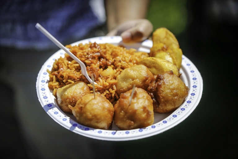 Heaping plate of food being offered