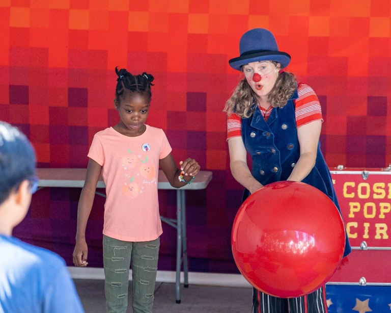 A clown and a child.