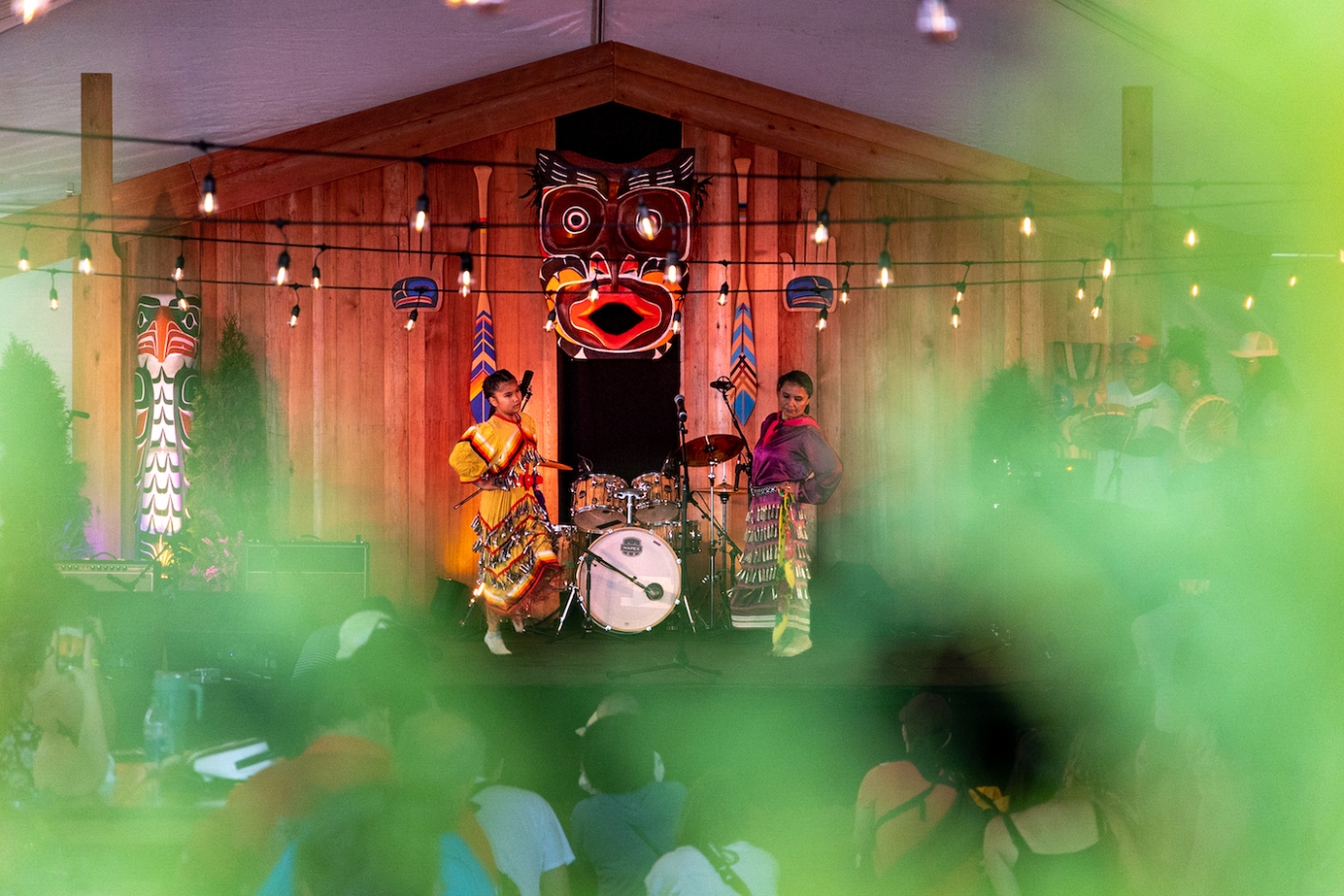 Indigenous pow-wow dancers perform on Siam stage