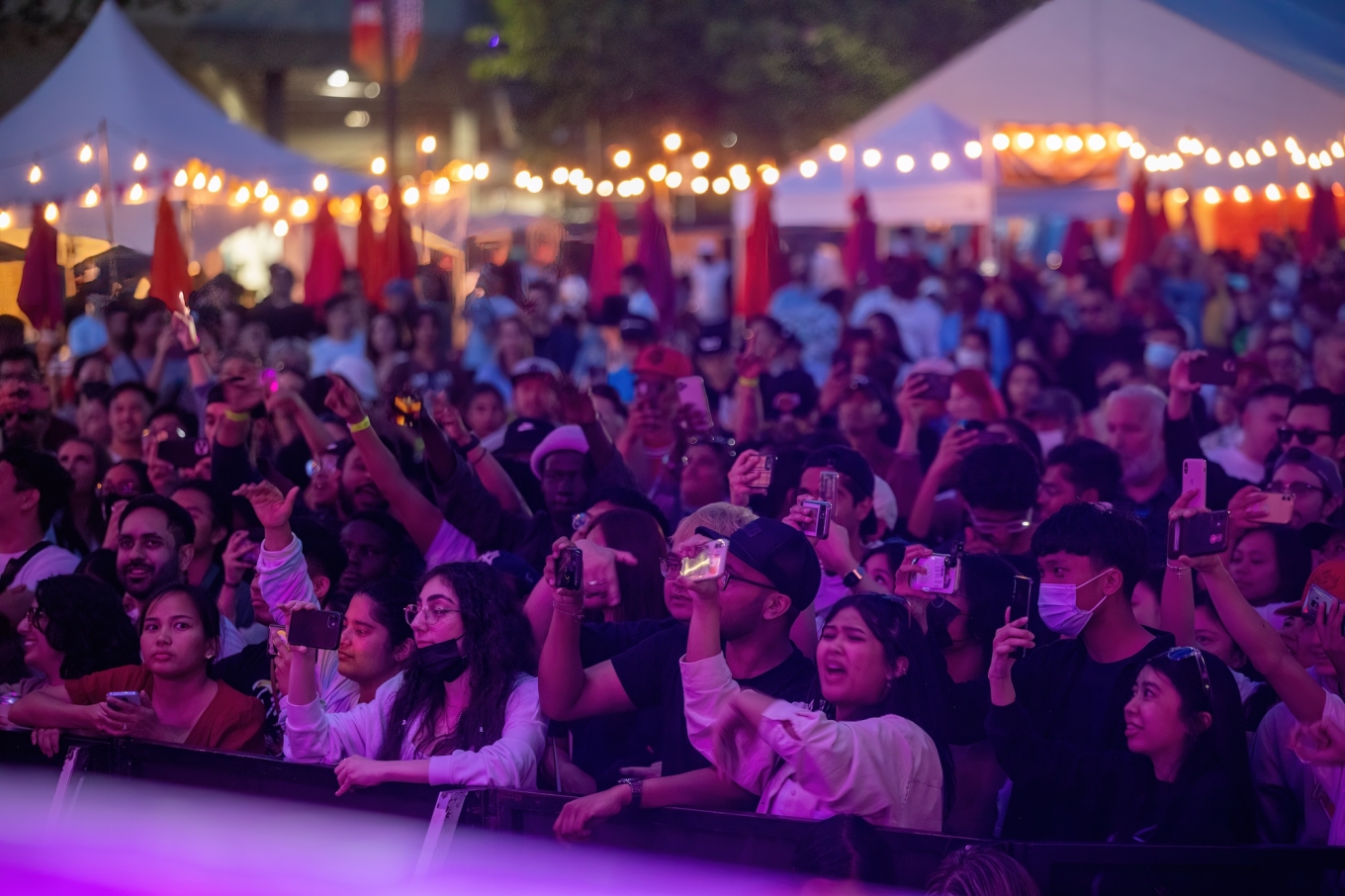 Large eager audience press close to the main stage for performing headliner