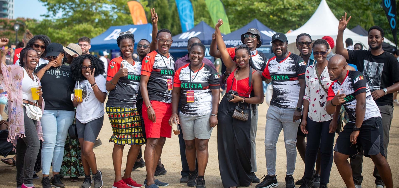 Kenya pavilion members smiling at camera